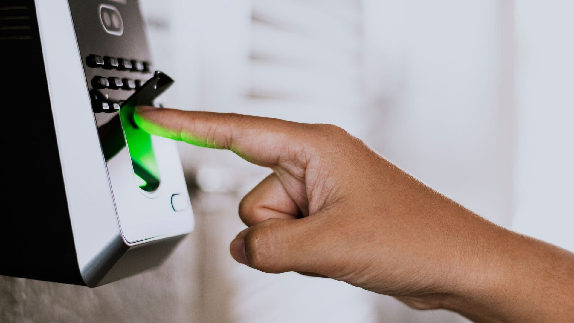 Scanning your finger on a fingerprint access control. Image from www.freepik.com